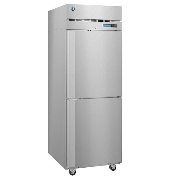 A silver Hoshizaki reach-in refrigerator with two half solid doors.
