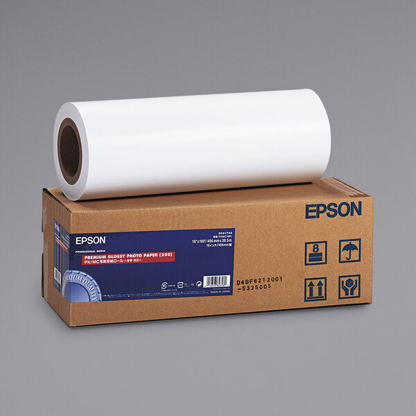 A box of Epson glossy white photo paper with a roll on top.