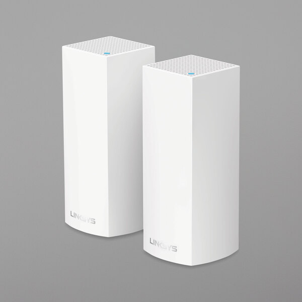 Two white rectangular Linksys Velop wireless routers.