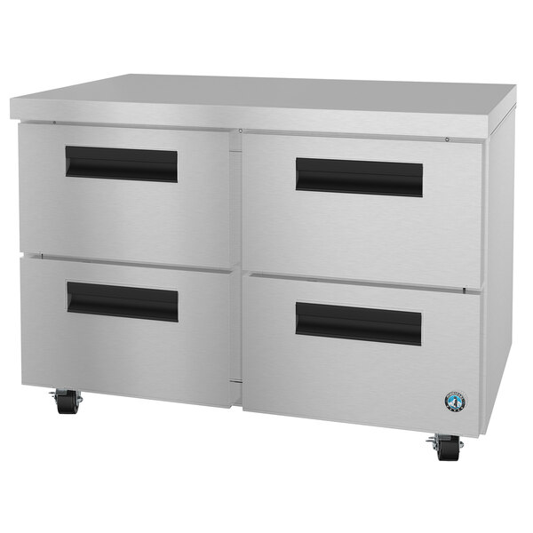 A stainless steel Hoshizaki undercounter freezer with black drawers.