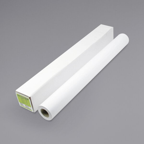 A white roll of HP Inc. DesignJet Universal Bond Photo Paper next to a white box.