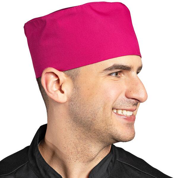 A man wearing an Epic Berry chef skull cap with a hook and loop closure and smiling.