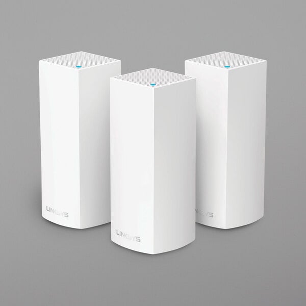 Three white rectangular Linksys mesh wifi routers.