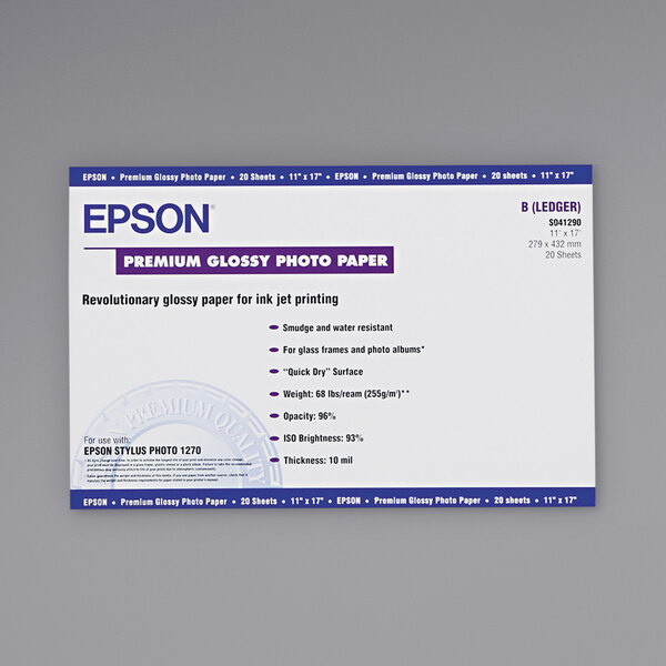 A package of white Epson photo paper with blue and black text on a white and blue label.
