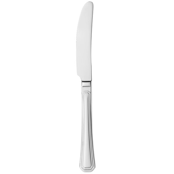 A silver Libbey High Society dinner knife with a serrated blade.