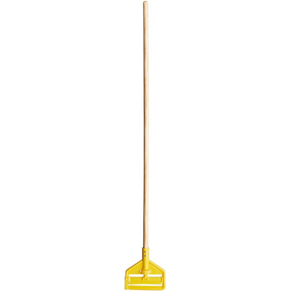 A Rubbermaid wooden mop handle with a yellow plastic side gate.