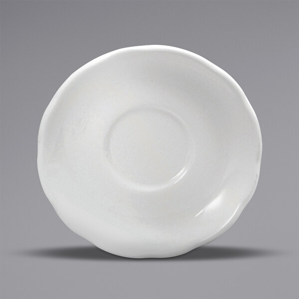 A close-up of a white Oneida Buffalo Caprice saucer with a scalloped edge.