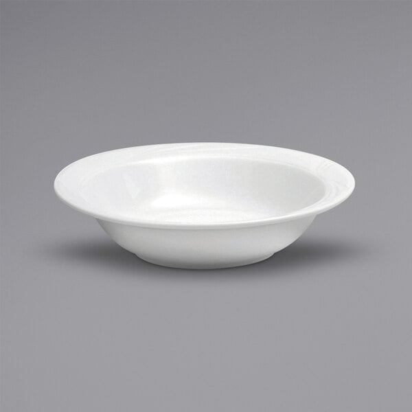 A Oneida Buffalo Arcadia bright white porcelain pasta or salad bowl with an embossed medium rim.