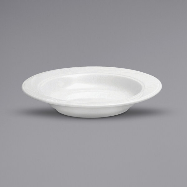 A Oneida Buffalo Arcadia bright white porcelain deep soup bowl with an embossed rim.
