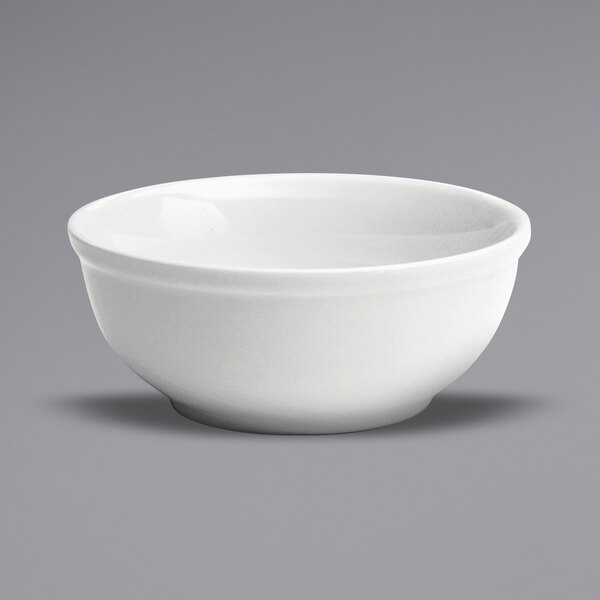 A Oneida Buffalo Bright White Ware porcelain nappie bowl on a white surface.