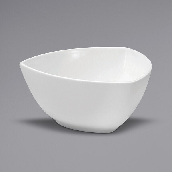 A white triangular porcelain bowl.