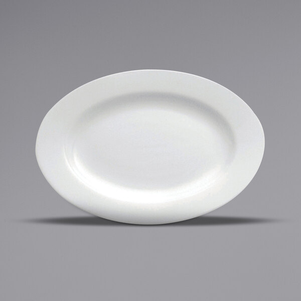 A close-up of a Oneida Buffalo Bright White Ware rolled edge oval porcelain platter on a gray surface.