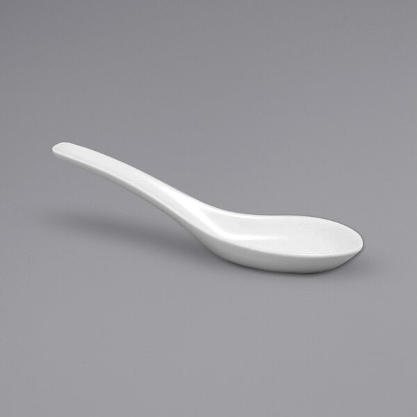 A white Oneida porcelain Chinese soup spoon.