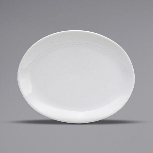 A white oval porcelain platter with a small rim.
