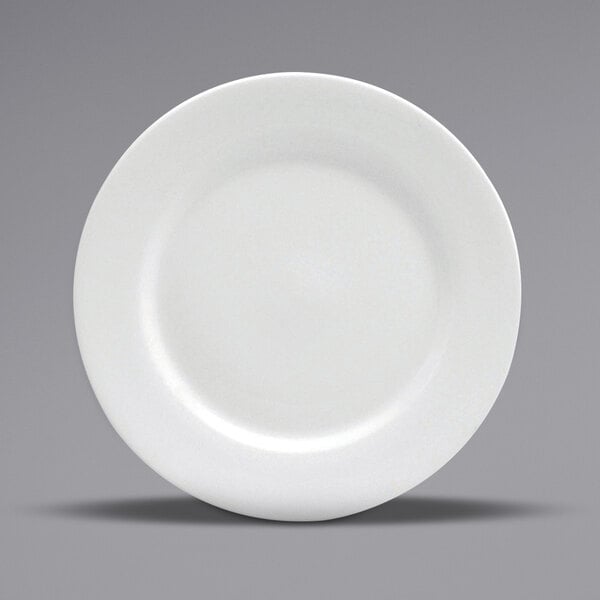 A close-up of a Oneida Buffalo Bright White Ware porcelain plate with a rolled edge.