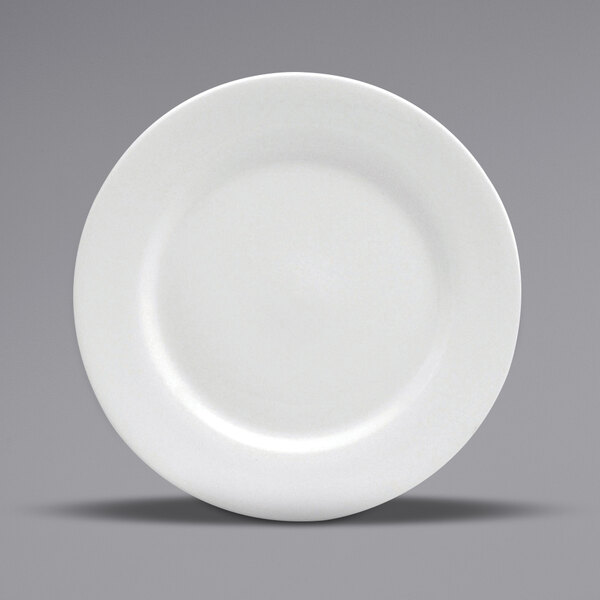 A close-up of a white Oneida Buffalo porcelain pasta bowl with a wide rim.