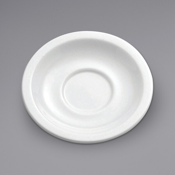A white porcelain saucer with a circular ring.