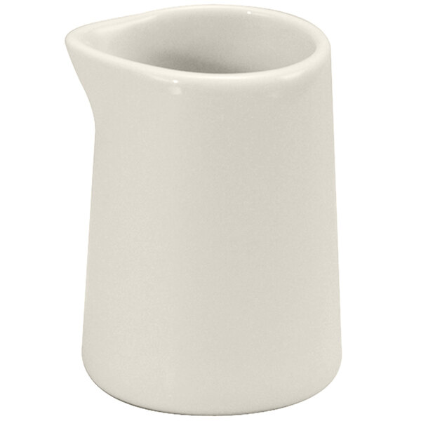 A Oneida Buffalo white porcelain creamer with a handle.