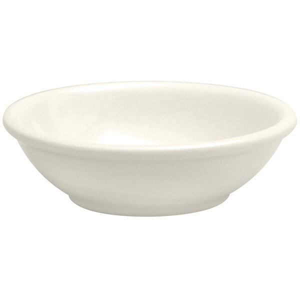 A Oneida Buffalo Cream White Ware porcelain fruit bowl with a white background.