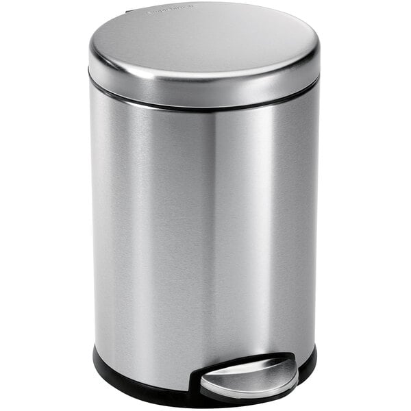 A simplehuman silver stainless steel round step-on trash can with a black lid.