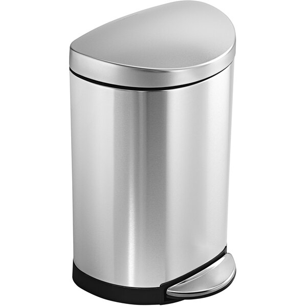 A simplehuman stainless steel semi-round step-on trash can with a black lid.