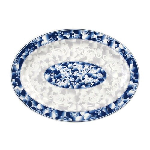 A blue and white oval Thunder Group melamine platter with a blue dragon design.