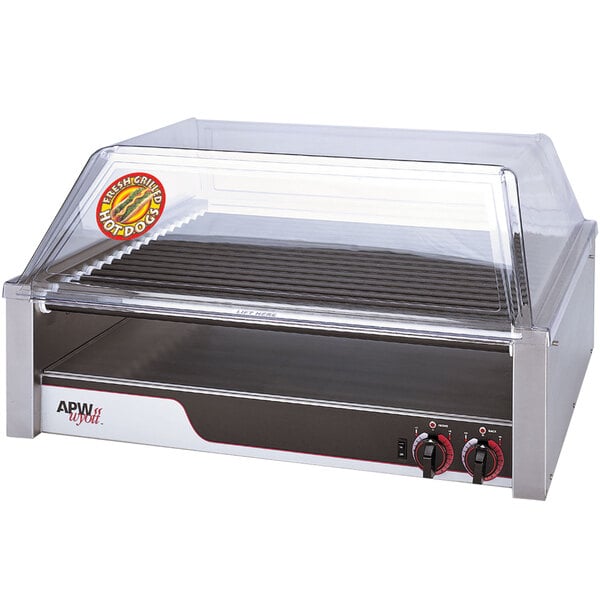 An APW Wyott hot dog roller grill with a clear double door sneeze guard.