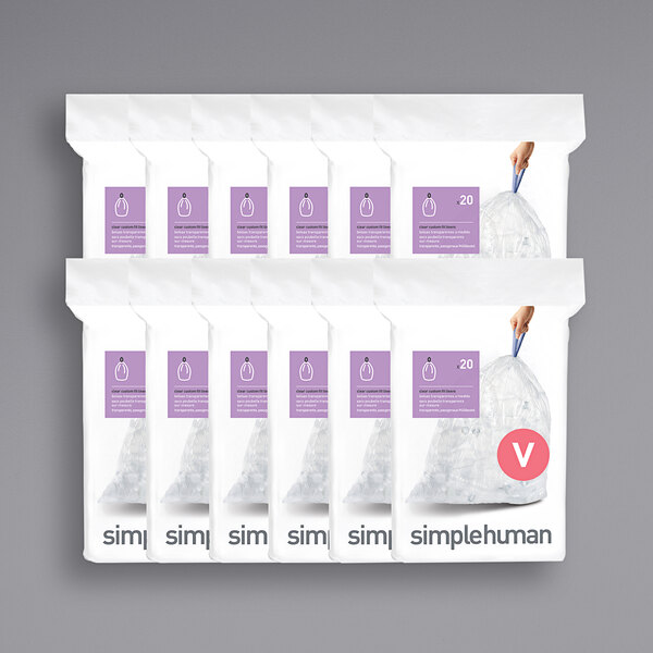 A group of packages of clear simplehuman Code V custom fit trash can liners.