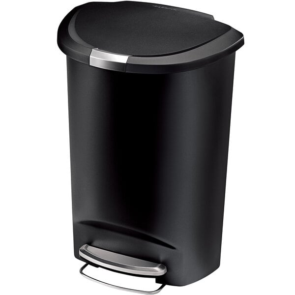 A simplehuman black semi-round step-on trash can with a lid.