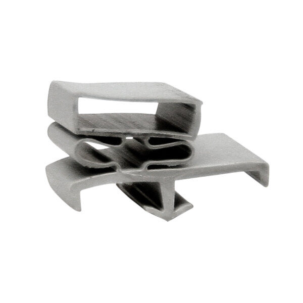 A grey plastic drawer gasket clip with two different shapes.