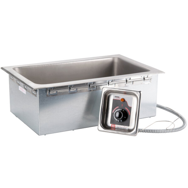 An APW Wyott drop-in food warmer with a lid and a drain.