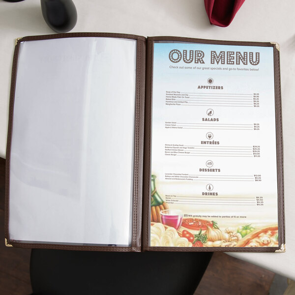 8 1/2" x 11" Italian themed menu paper with a pasta design on a table in an Italian restaurant with a glass of wine.