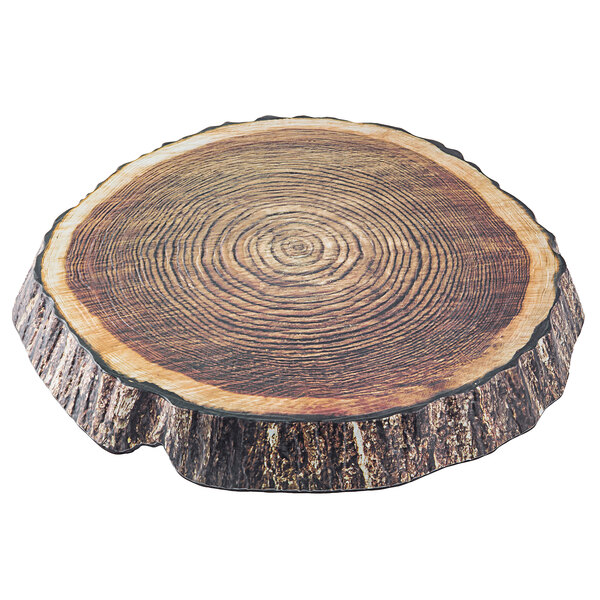 A Tablecraft melamine platter with a wood design that looks like a tree stump ring.