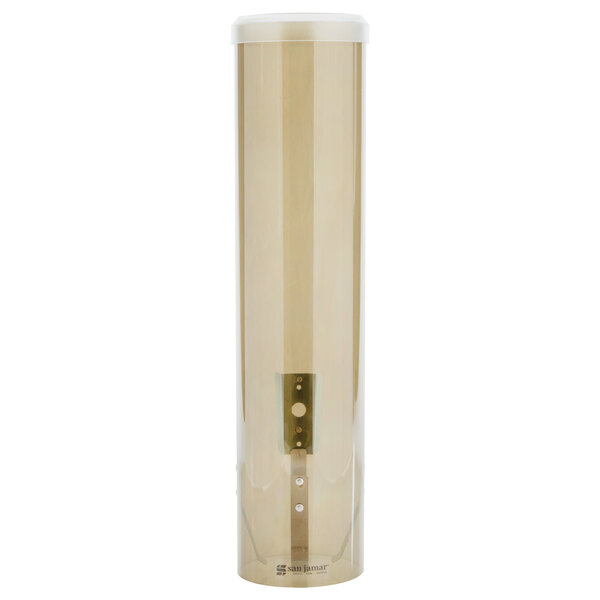 A clear cylinder with a bronze top holding white cups.