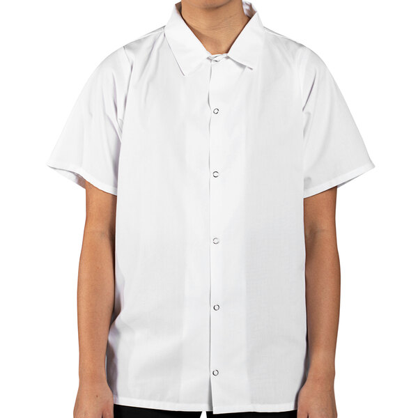 A person wearing a white Uncommon Chef cook shirt.
