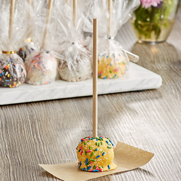 A cake pop with sprinkles on a EcoChoice Kraft paper stick.
