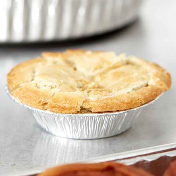 A close-up of a pie in a D&W Fine Pack foil tart pan.