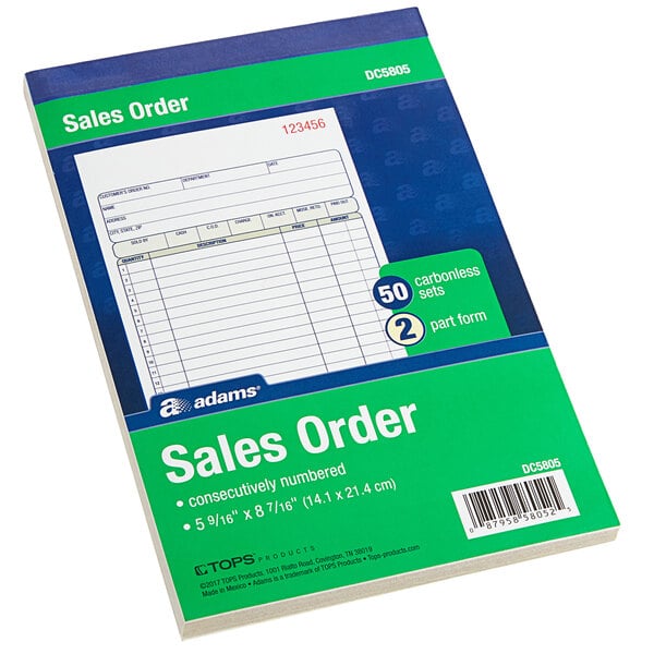 An Adams 2-part carbonless sales order book on a grocery store counter.