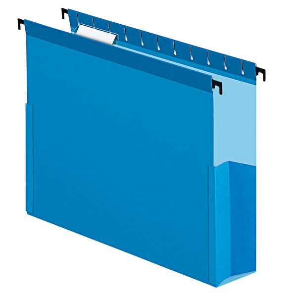 A blue Pendaflex hanging box file with a white label.