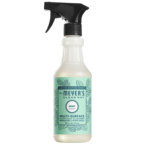 A white spray bottle of Mrs. Meyer's Mint All Purpose Cleaner on a table.