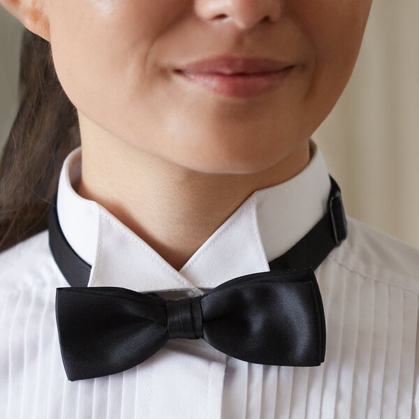 A woman wearing a black Henry Segal adjustable band bow tie.
