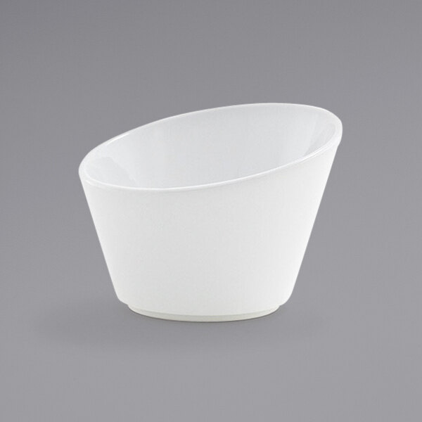 A Front of the House Harmony white porcelain slanted appetizer/fry cup.