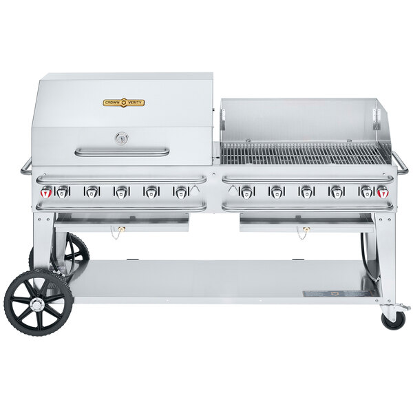 A Crown Verity stainless steel portable grill on a cart with a dome and wind guard.