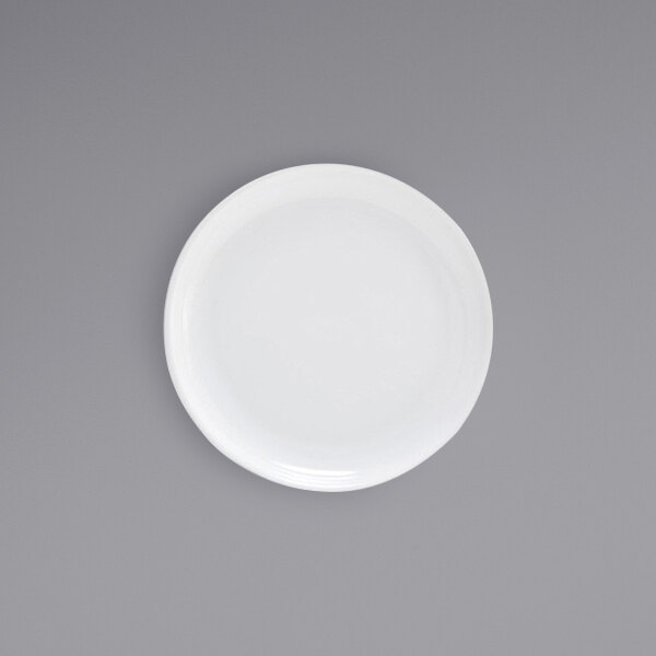 A Front of the House Harmony bright white porcelain plate on a gray surface.