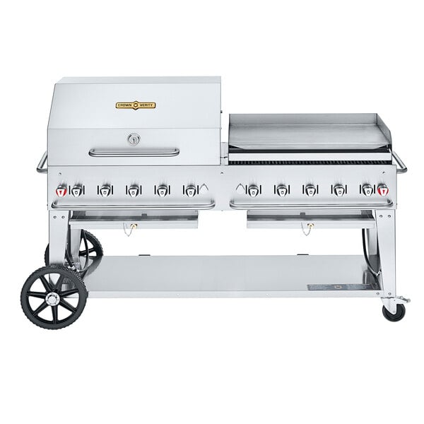 A large stainless steel Crown Verity outdoor grill with a roll dome and griddle.