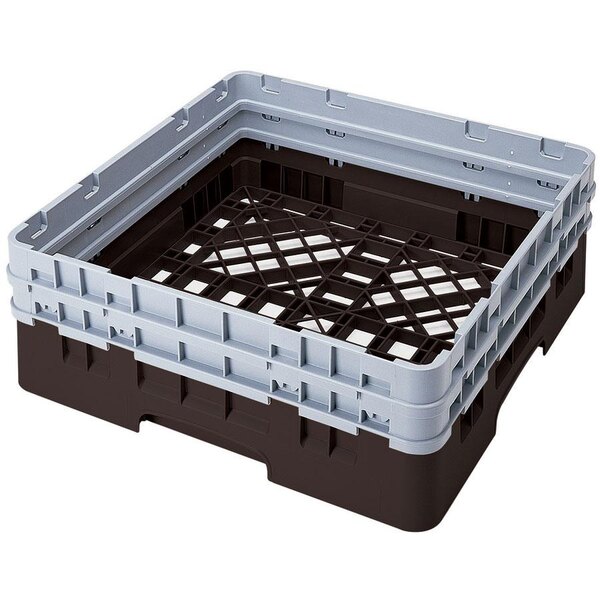A brown Cambro Camrack base with closed sides and 2 extenders.