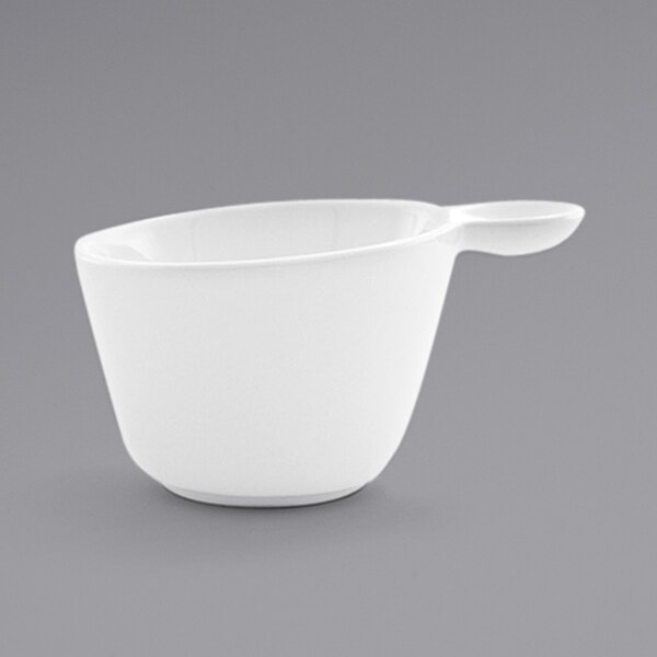 A Front of the House Harmony bright white porcelain cup with a handle.