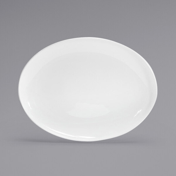 A white oval plate on a gray background.