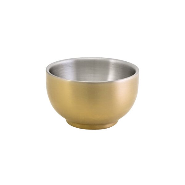 A close-up of a matte brass brushed stainless steel round double wall ramekin.