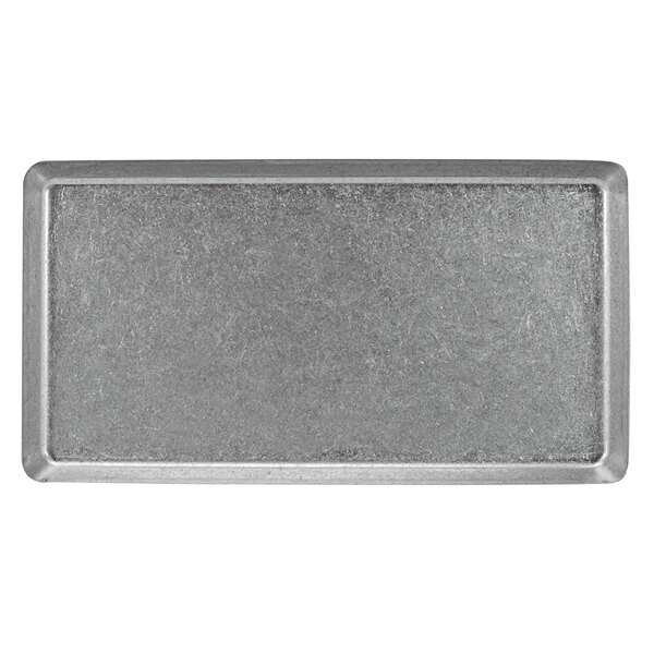 A rectangular stainless steel plate with an antique finish.
